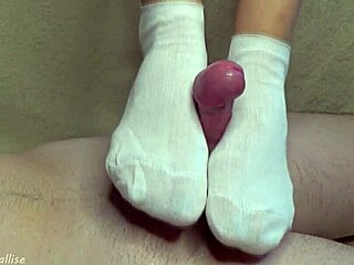 Foot fetishist babe gives a footjob in white socks
